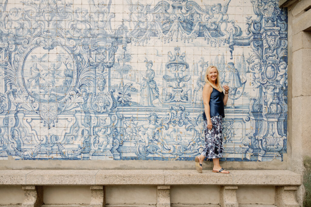 Standing in front of the baroque azulejo tile wall at Porto Cathedral