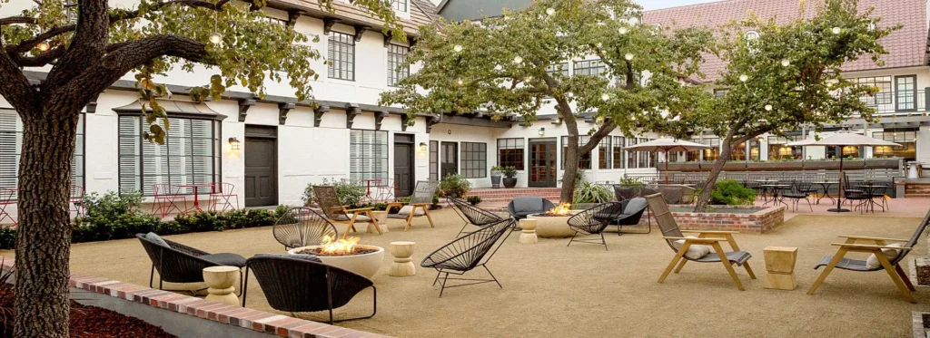 Courtyard string lights and outdoor seating at The Landsby hotel in Solvang